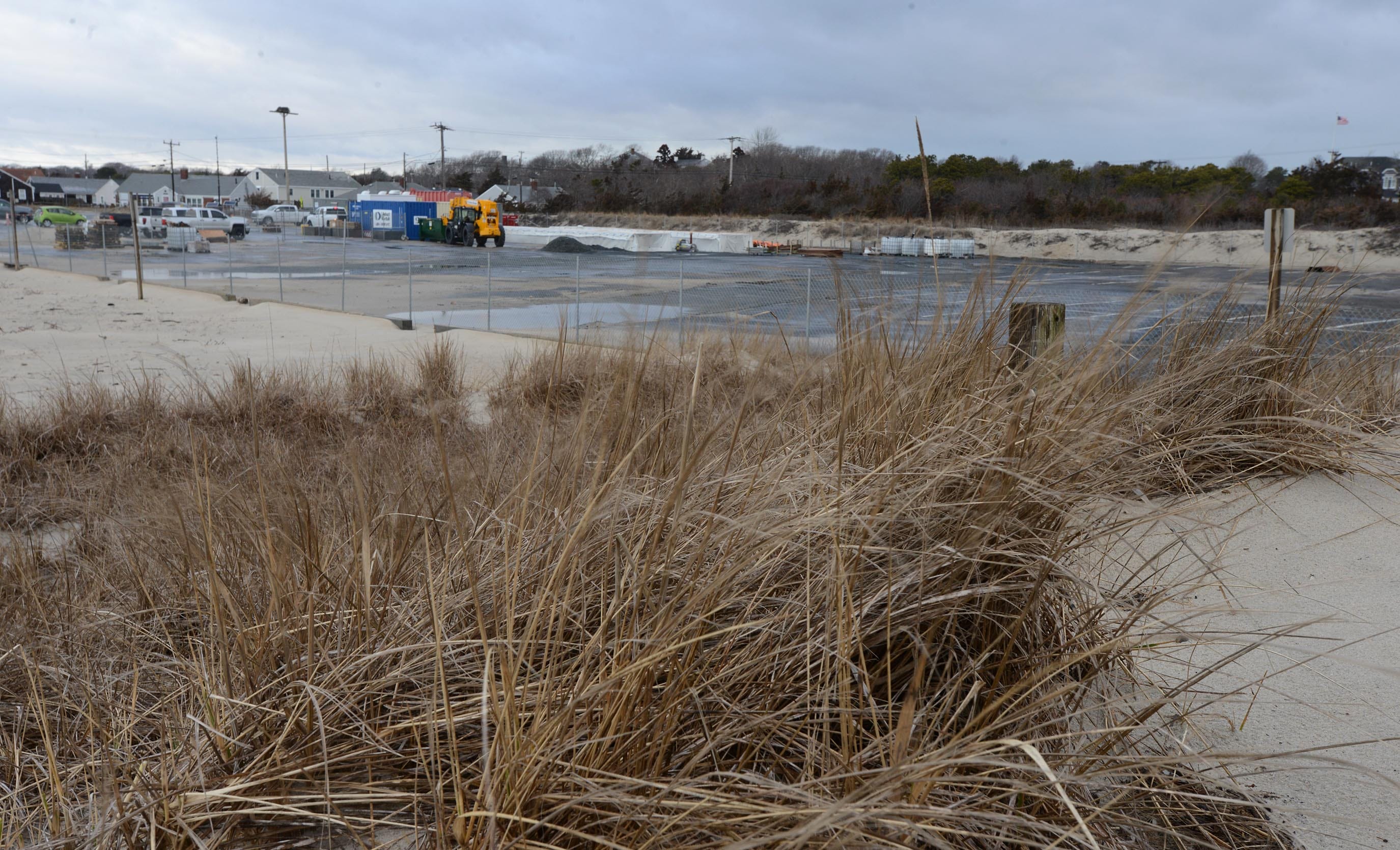 The parking lot at Covell Beach in Centerville, the cable landfall spot for a Vineyard Wind offshore wind project, was emptying out Wednesday as crews prepared to resurface the lot for the upcoming beach season.