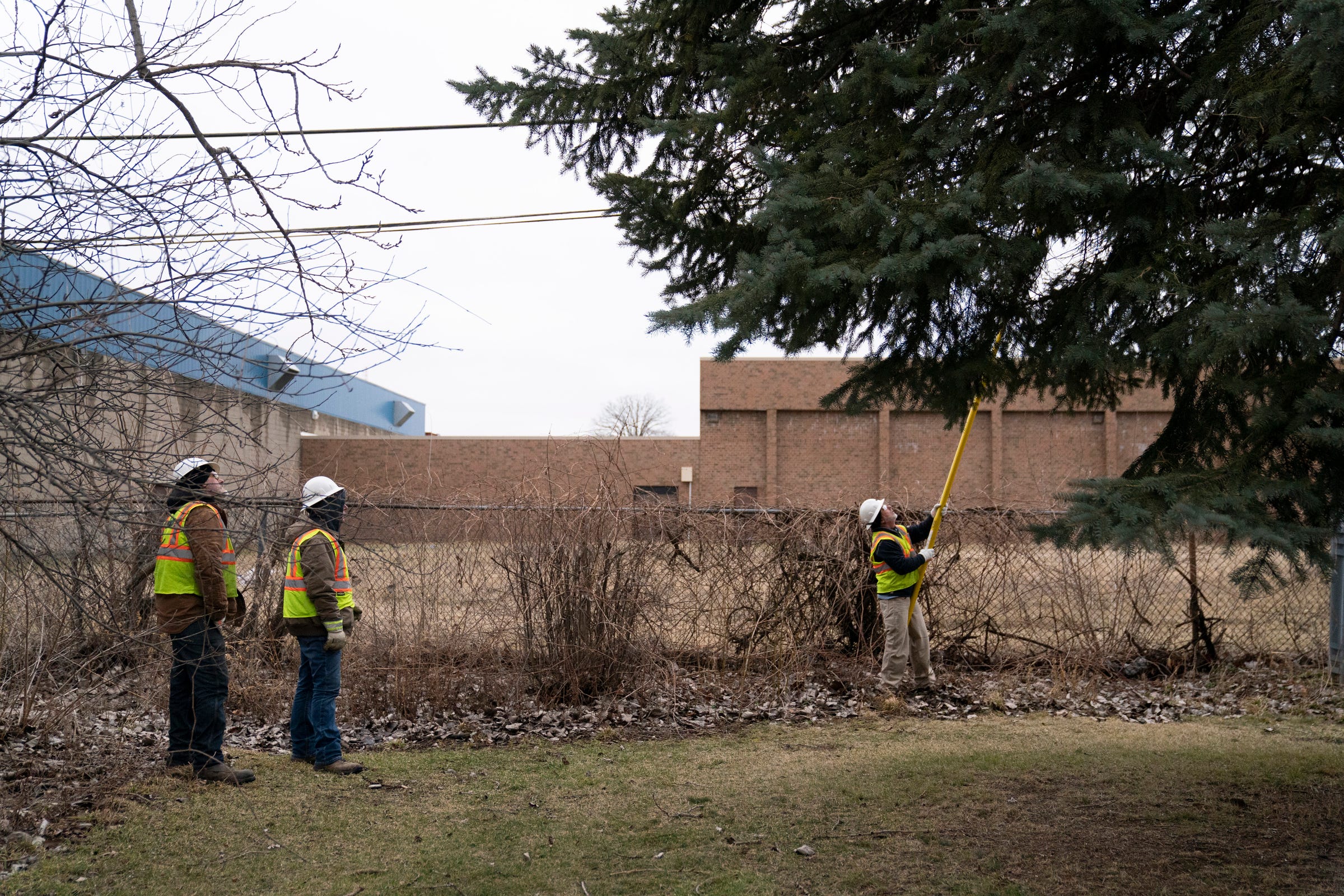 Line workers subcontracted by DTE, turn on repaired electrical lines in Detroit on Tuesday, Feb. 28, 2023.