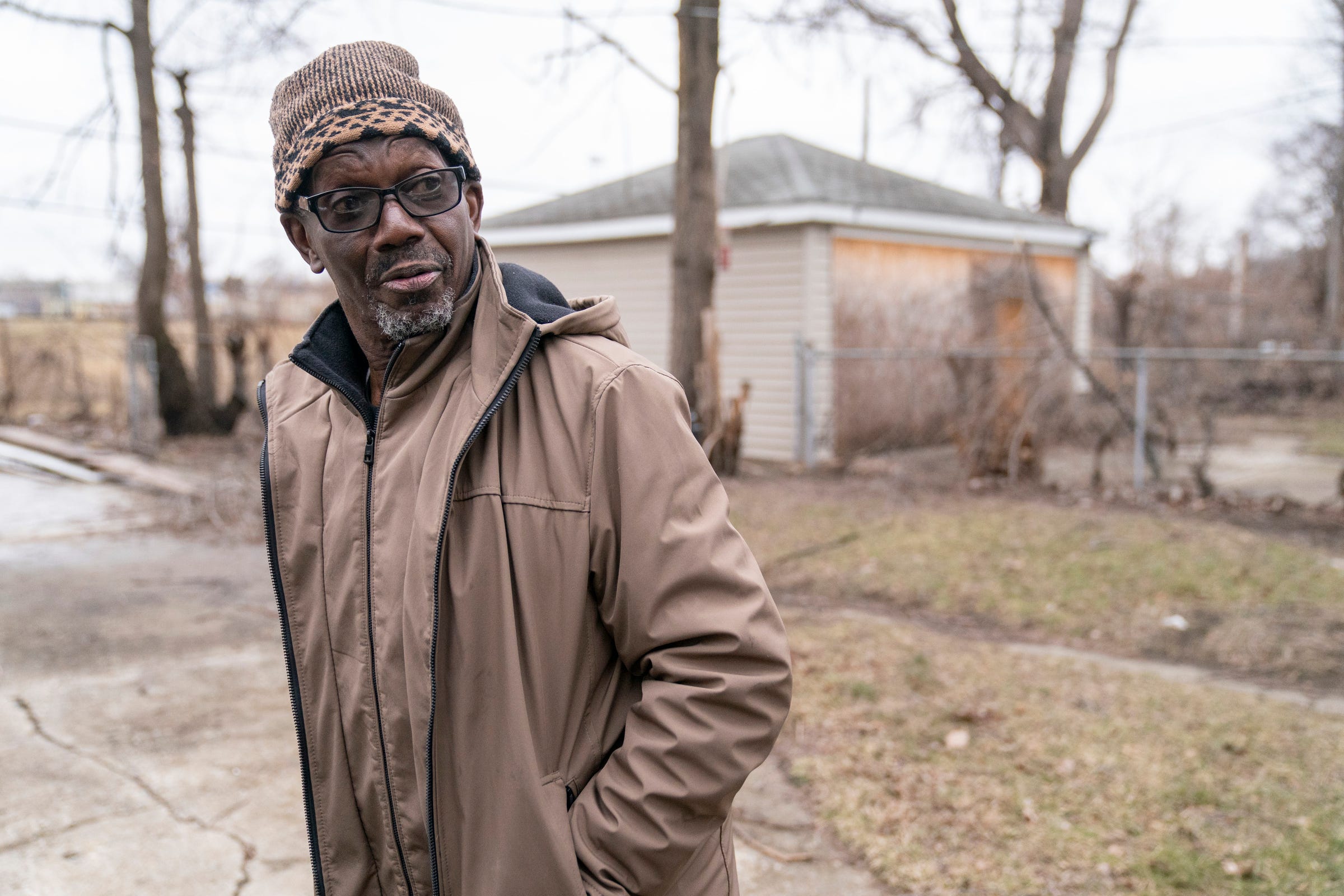Omar Mannan, 68, of Detroit, comes out and talks to DTE line worker Seth Hartwick, of Belleville, on Tuesday, Feb. 28, 2023, minutes after his power was restored.